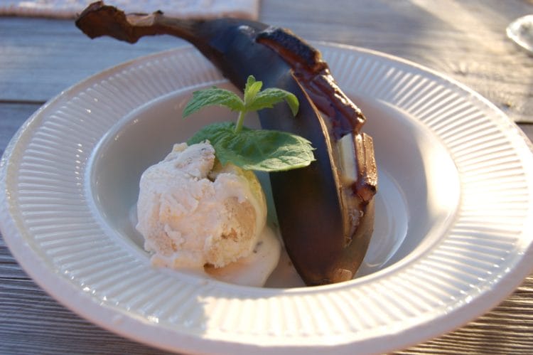 Grilled banana with melted chocolate and ice cream