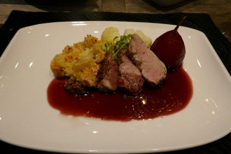 Pork fillet sous vide with red wine boiled pear, red wine sauce and exciting potatoes