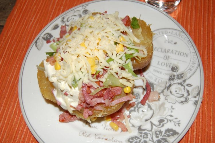 Baked potato with delicious side dishes