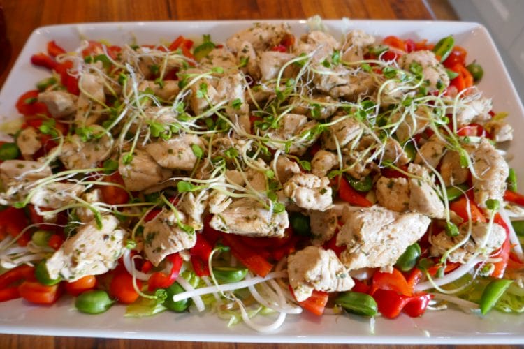 Chicken salad with kiwi berries, bean sprouts and radish sprouts