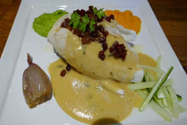 Halibut fillet with fried bacon, pickled cucumber, carrot puree, pea puree, baked shallots and pasta sauce Halibut fillet with fried bacon, pickled cucumber, carrot puree, pea puree, baked shallots and pasta sauce