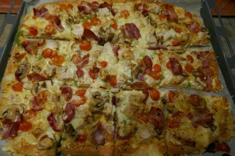White pizza with turkey, bacon and mushrooms