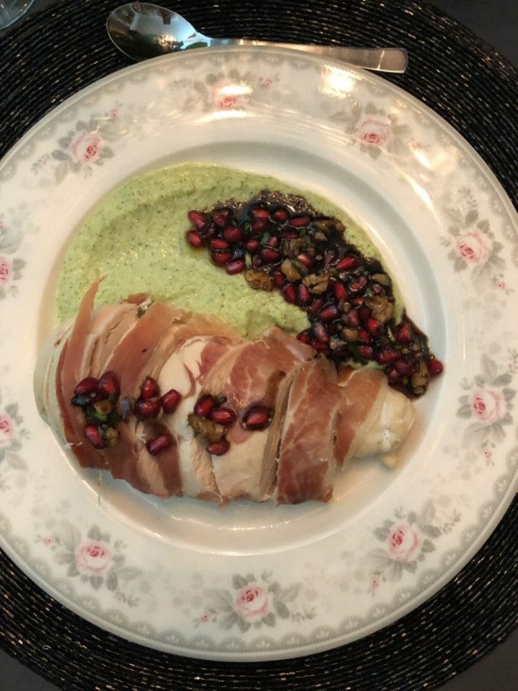 Baked chicken breast with broccoli puree and pomegranate