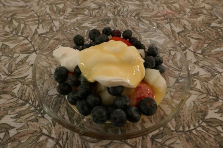 Berries with vanilla whipped cream and egg liqueur
