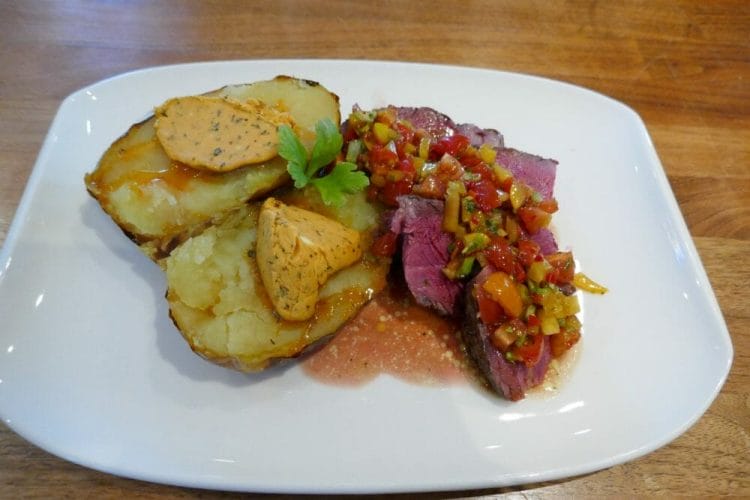 Côte de boeuf with baked potato, spicy butter and salsa