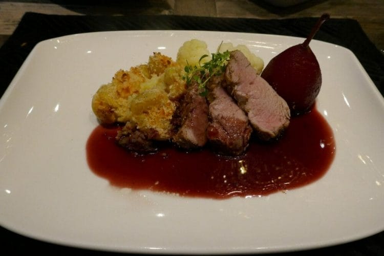 Pork fillet sous vide with red wine boiled pear, red wine sauce and exciting potatoes 