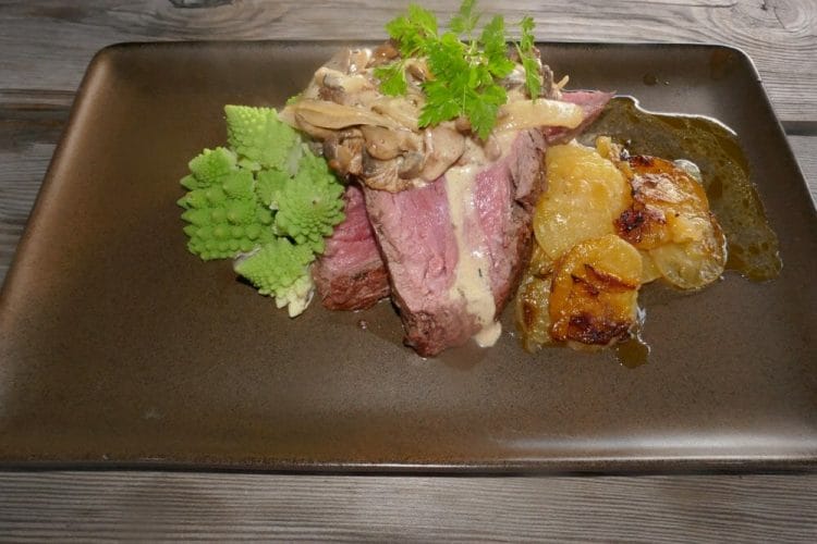 Whole-roasted tenderloin with French fries and mushroom sauce Whole-roasted tenderloin with French fries and mushroom sauce